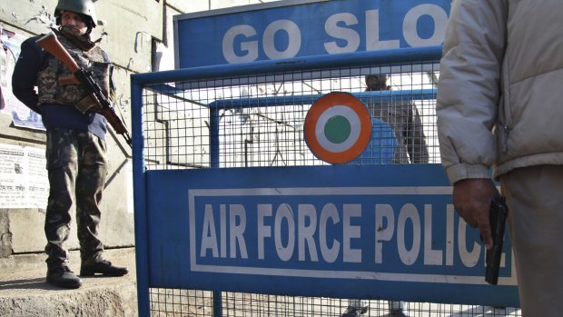 Indian security forces stand guard outside Pathankot air base.