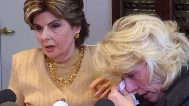 Heather Kerr, a former actress weeps her attorney Gloria Allred speaks at a press conference.
