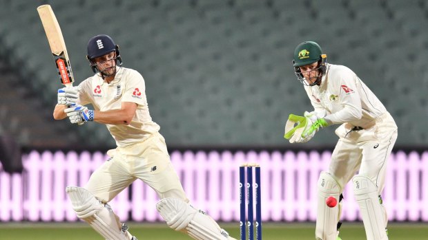 Shock selection: Chris Woakes gets a ball past Tim Paine during England's match against a Cricket Australia XI at Adelaide Oval.