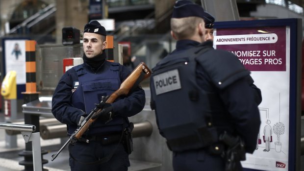 French police officers patrol the platforms at the Gare du Nord train station in Paris, France on Saturday.