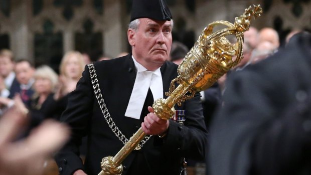 Hailed as hero: Sergeant-at-Arms Kevin Vickers is applauded in the House of Commons in Ottawa.