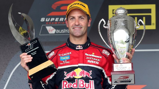 Double honours: Holding the Jason Richards Memorial Trophy and the Race 24 Trophy, Jamie Whincup celebrates winning race 24 during the ITM Auckland SuperSprint at Pukekohe.