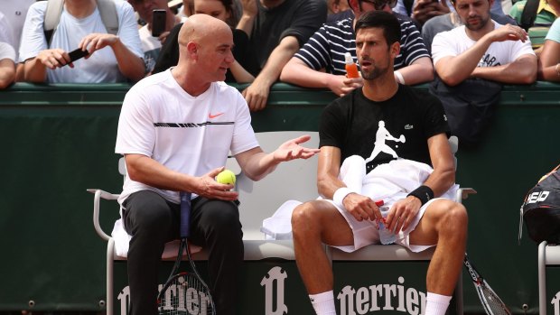 Novak Djokovic with coach Andre Agassi at the French Open.