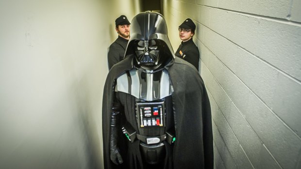 Darth Vader Jason Feldner (centre) and imperial officers Matt Mulcahy and Tegan Smith are members of Canberra's Black Tower Squad.