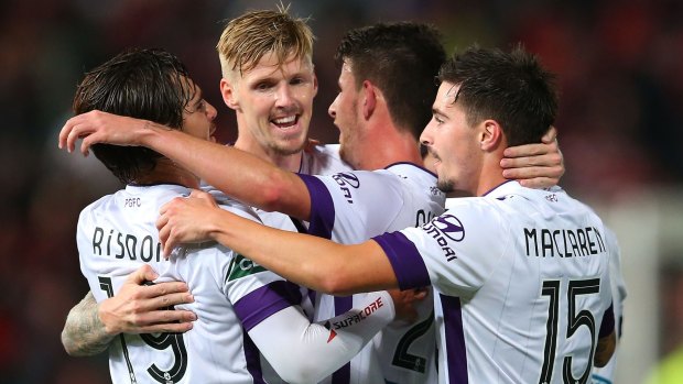Andrew Keogh of the Glory celebrates with team mates after scoring.