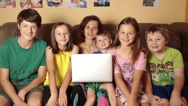 Anna Baroulina of Wanniassa, with children from left, Ivan, 14, Elizabeth, 10, George, 4, Veronica, 9, and Aleksey, 6. Anna is returning to study after 20 years to start a bachelor of midwifery at the University of Canberra.