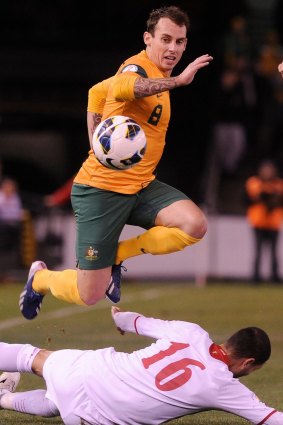 Luke Wilkshire playing for the Socceroos in 2013.