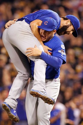 Jake Arrieta celebrates with Anthony Rizzo after his complete game shutout against the Pirates in the NL wildcard game.