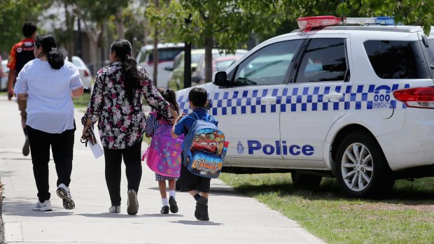 Parents take their children from a school in Craigieburn after a threat was made this week. 