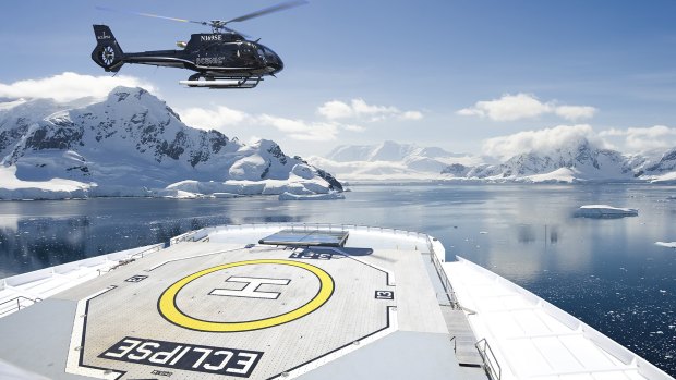 One of two on-board Airbus helicopter lands on the flight deck of Scenic Eclipse in Antarctica.
