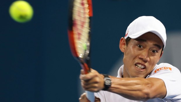Disappointing result: Kei Nishikori returns fire against Dimitrov.
