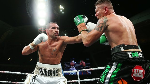 Anthony Mundine reaches out.