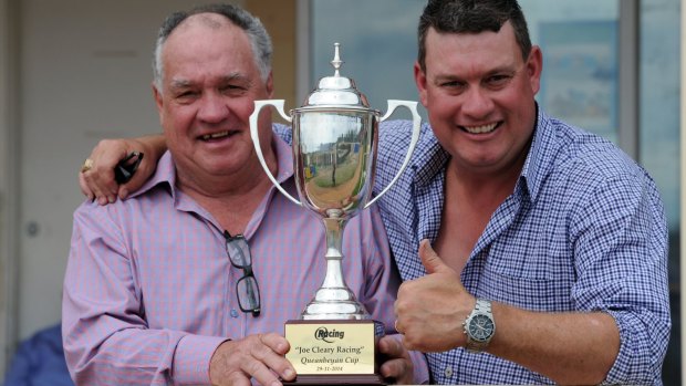 In the family: Queanbeyan trainer Joe Cleary, with his father Frank, gives the thumbs up after winning last year's cup.