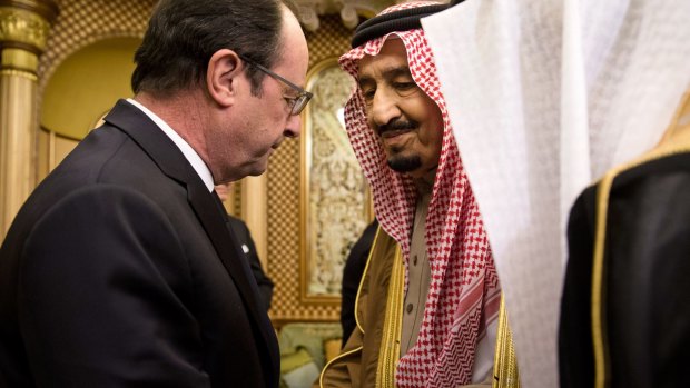 French President Francois Hollande, left, offers his condolences to Saudi Arabia's new King Salman .