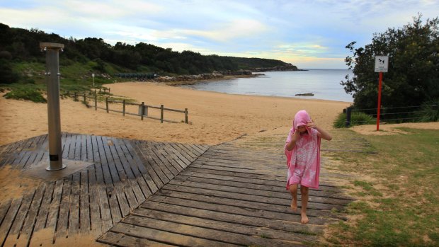 Mercury pumped into the ocean: Children play in the shallows of Malabar Beach.