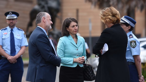 NSW Premier Gladys Berejiklian, centre, has ruled out a fare-free day or refund to compensate passengers.