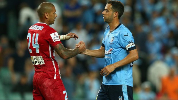 Respect: Melbourne City FC captain Patrick Kisnorbo and Sydney FC captain Alex Brosque embrace following the stalemate.