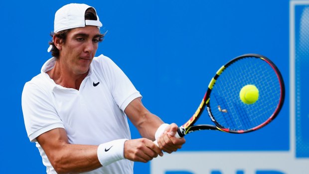 Grass guy: Thanasi Kokkinakis plays a backhand in his men's singles first round match against Jeremy Chardy.