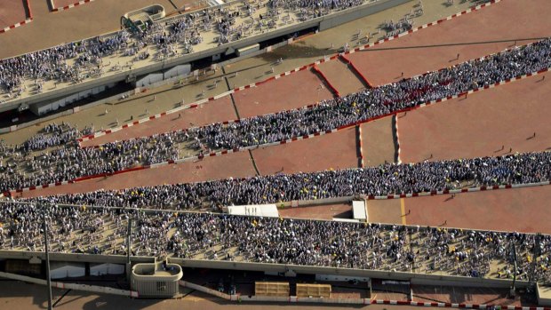 Hundreds of thousands of Muslim pilgrims make their way to cast stones at a pillar symbolising the stoning of Satan in a ritual called Jamarat, the last rite of the annual haj.
