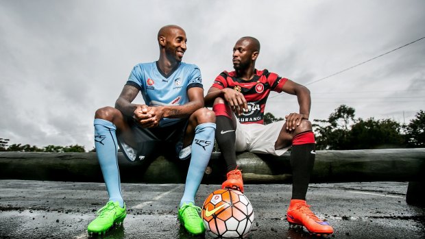 Sydney FC player Mickael Tavares with Western Sydney Wanderers player Romeo Castelen - their friendship has risen above perhaps the biggest rivalry in Australian sport.