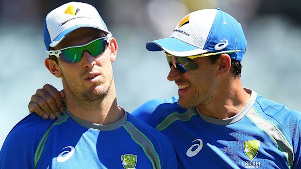 Mitch Marsh and Mitchell Starc warm up before the start of play on day three.