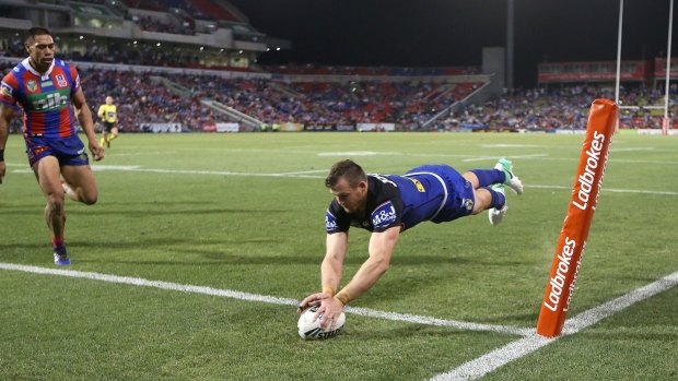 Centre of excellence: Josh Morris goes over in the corner for Canterbury.