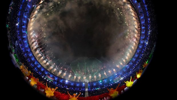Pyrotechnics explode during the closing ceremony of the 2016 Olympic Games at Maracana Stadium.