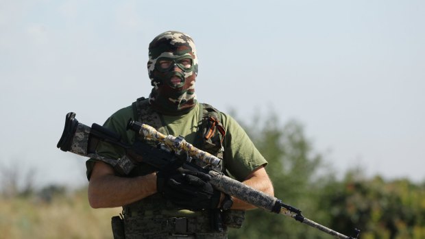 War has roiled eastern Ukraine for years. A pro-Russian rebel sniper is pictured at a checkpoint on the outskirts of Shakhtersk, in Ukraine's eastern Donetsk region, in July 2014.