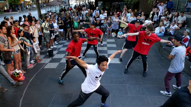 We're the best: The Young Masters break-dancing crew perform in Swanston Street.
