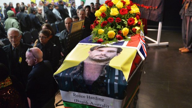 Reece Harding's coffin was draped with both the Kurdish and Australian flags. 