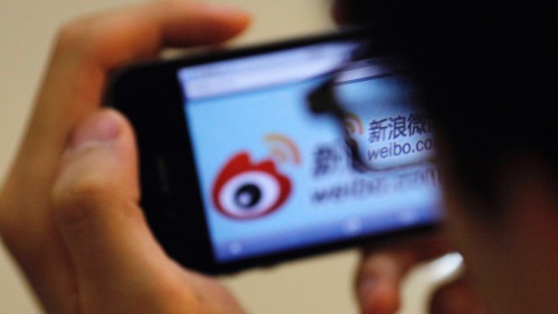 Using a phone to visit the Sina Weibo microblogging site in China.