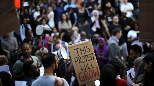 Protesters gather outside Kensington and Chelsea town hall on Friday.