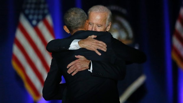 Barack Obama hugs Joe Biden after giving his presidential farewell address.