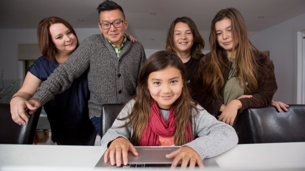 Susan and Phillip Sohn with their children Ella, Phillip and Sophia n their Avoca North home on the Central Coast.