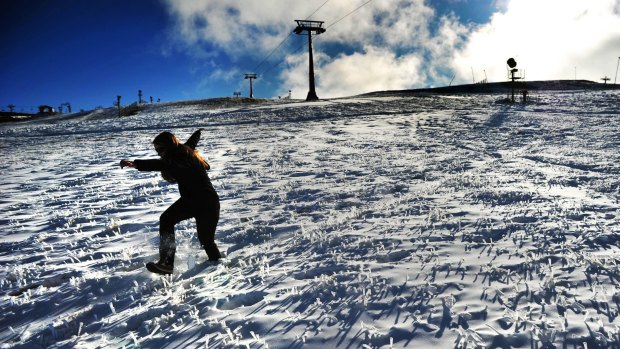 Snow covered grass and plenty of man-made snow on the Bourke street run at Mt Buller.