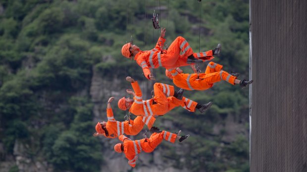 Performance of members of the theatre Dimitri on the opening day of the Gotthard rail tunnel.