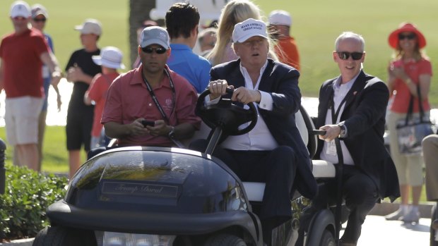 Donald Trump drives himself around the golf course in Doral, Florida. 
