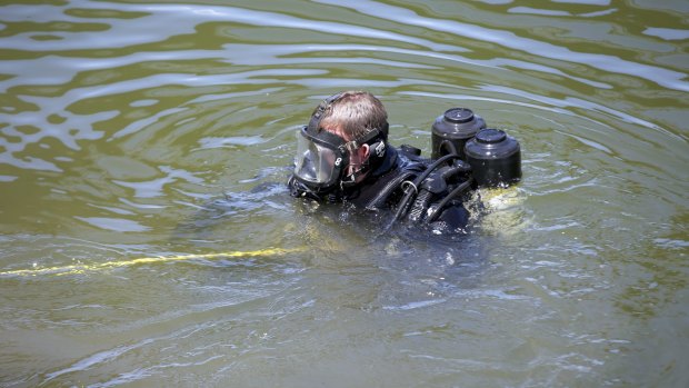 A police diver in the Maribynong River.