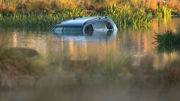 Akon Guode's car in the lake where three of her children died in April 2015.