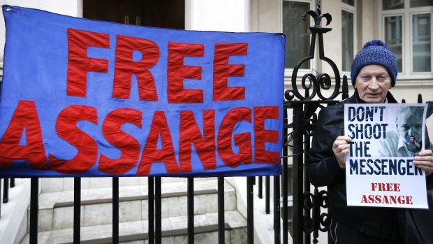 A demonstrator outside Ecuador's London embassy.