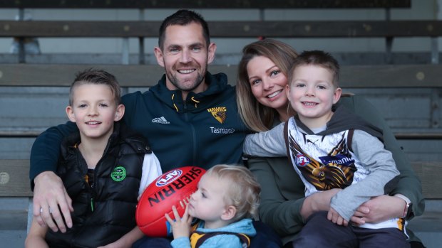 Family man: Luke Hodge with wife Lauren and children Cooper, Leo and Chase on Monday. 