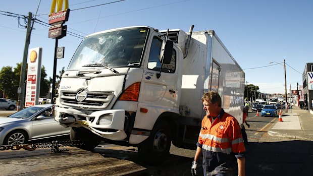 A truck are towed away.