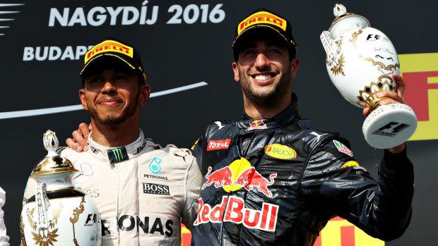 Fast finishers: Daniel Ricciardo of and Lewis Hamilton celebrate on the podium.
