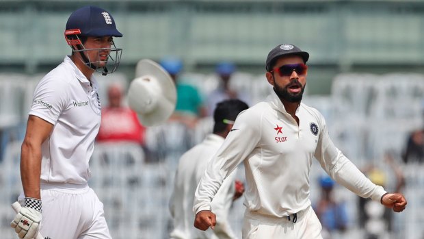 Future clouded: India's captain Virat Kohli, right, celebrates the dismissal of England's captain Alastair Cook during the fifth Test.