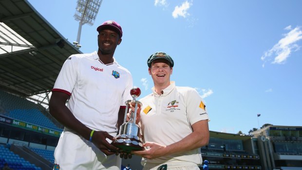 Up for grabs: West Indies captain Jason Holder and Australian captain Steve Smith pose with the Frank Worrell Trophy at Blundstone Arena.