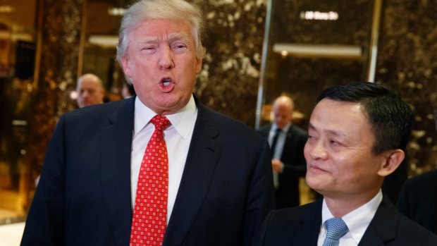 President-elect Donald Trump, accompanied by Alibaba executive chairman Jack Ma, speaks with reporters after a meeting at Trump Tower in New York.