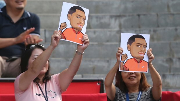 Local favourite: Japanese fans hold up portraits of Nick Kyrgios.