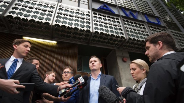 Sally McManus and Daniel Walton speak to the media after AFP raided the Spencer Street offices of the AWU. last month. 