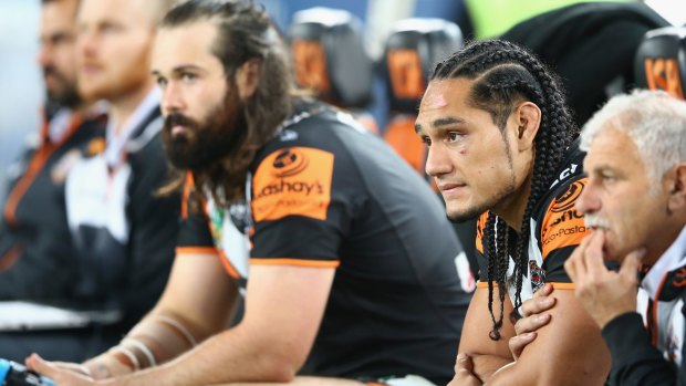 Dejected: Aaron Woods and Martin Taupau look on during the Tigers' loss to the Roosters on Friday.