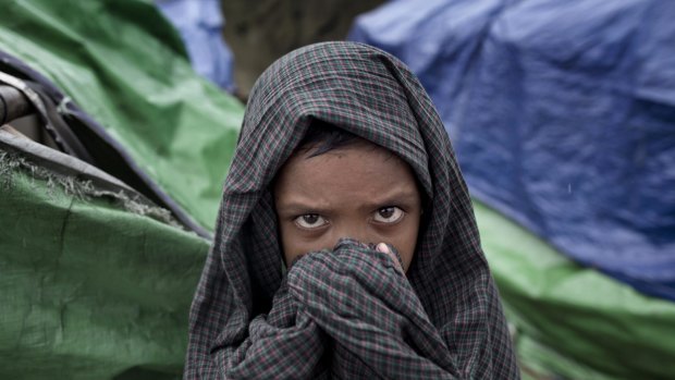 A boy self-identified as Rohingya stands in Dar Paing refugees camp in Myanmar. Rohingya are considered Bangladeshis by the Myanmar government and denied citizenship even if living in the country for generations.
